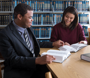 Political Science students looking through textbooks