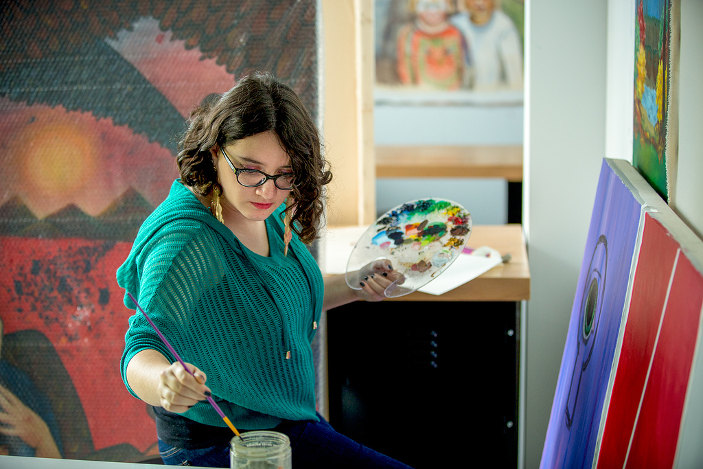 Student in art studio painting 