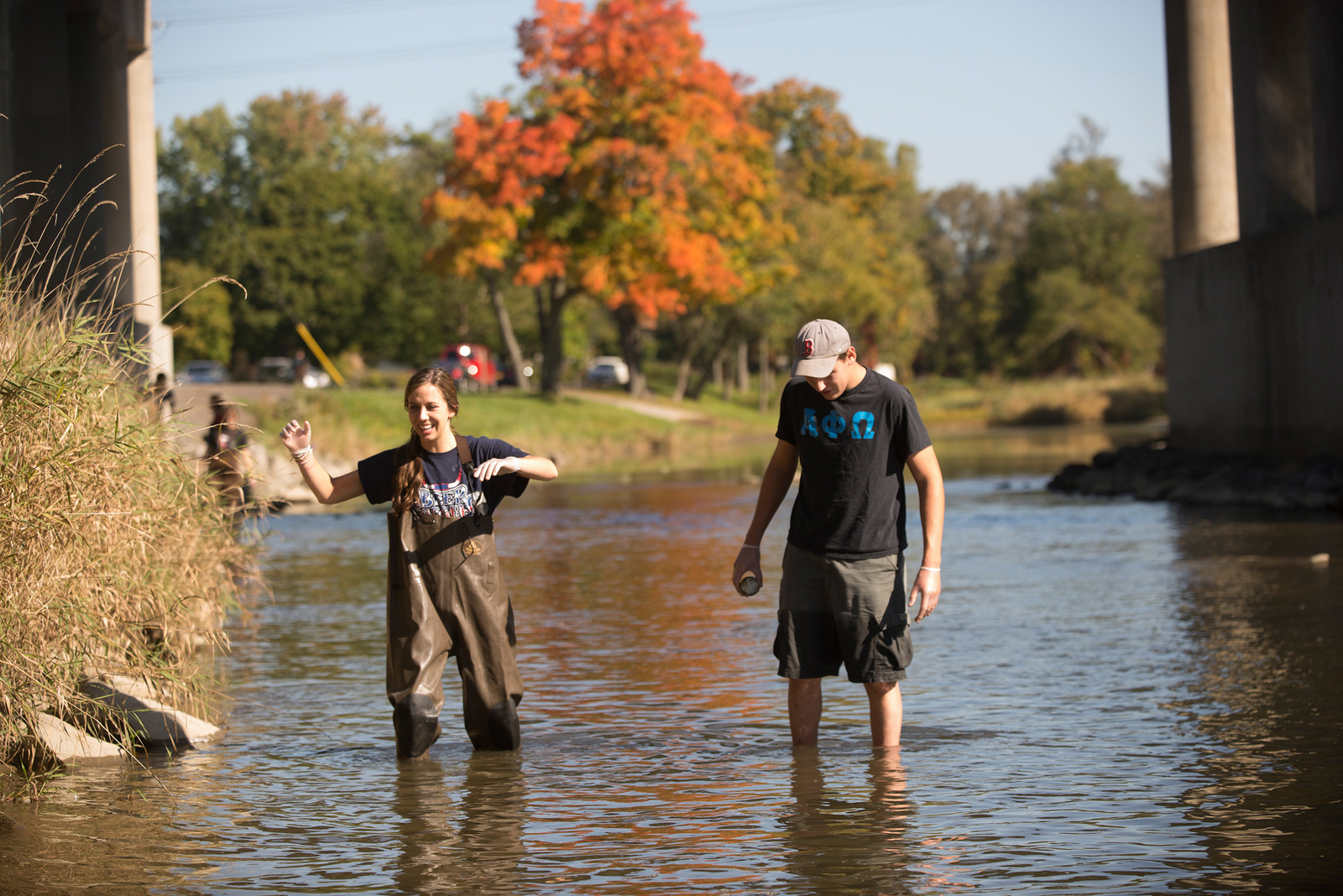 Geology students knee-deep in a stream